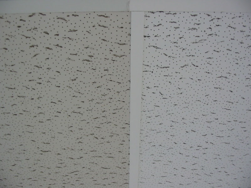 A ceiling with holes